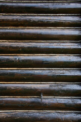 wooden beams at a cottage isolated with rope in Romania,Bistrita