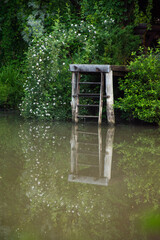 wooden staircase near the lake at a cottage, in Romania