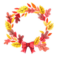 Colorful Autumn leaves with red bow ribbon wreath for decoration on Thanksgiving festival.