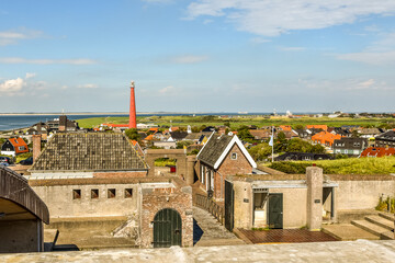 View of the coastal village of Huisduinen with the lighthouse 'Lange Jaap', Den Helder, the Netherlands.
