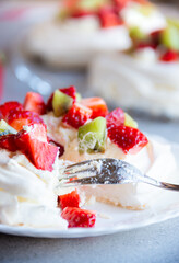Delicious Pavlova cake with meringue and fresh fruit