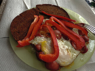 fried croutons with egg and sliced sweet pepper.