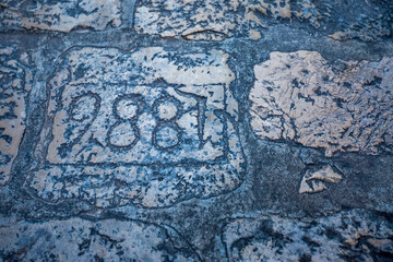 Colorful fortress street walk scene, Number 988 on stone pavement. Scenery winter view from Mediterranean old city of Dubrovnik, famous European travel and historic destination, Croatia