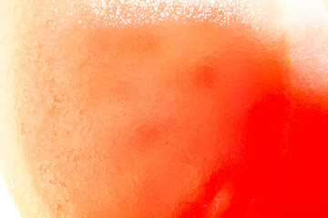 Fototapeta premium Background with sliced tomato under strong magnification in soft focus. A detailed image of the pulp of a ripe tomato.