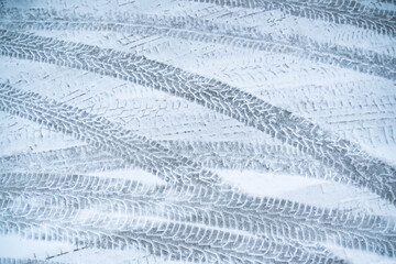 Snow covered road with tire tracks