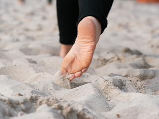 Moving feet of teenagers beach volleyball player