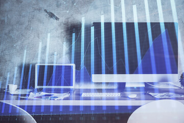 Financial graph colorful drawing and table with computer on background. Multi exposure. Concept of international markets.