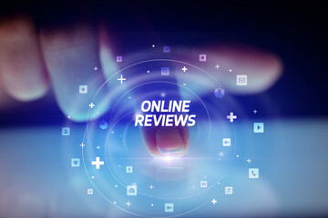Finger touching tablet with social media icons and ONLINE REVIEWS