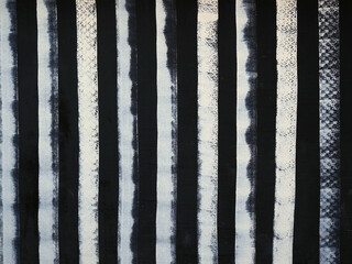 White wall painted with black stripes as texture and background.