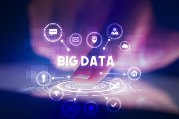 Finger touching tablet with web technology icons and BIG DATA inscription, web technology concept