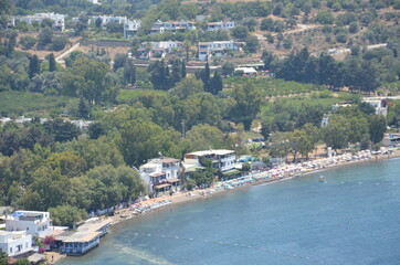 Top view of an entire bay of the Aegean Sea. Settlements spread over the hills.