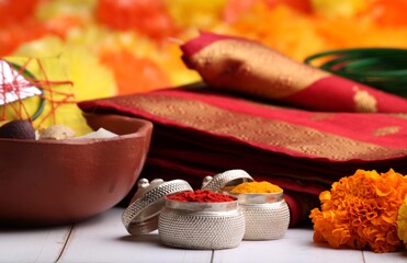 oti bharne - Indian ritual of offering a sari and a blouse piece along with coconut, haldi kumkum, bangles, mangalsutra and rice. At the time of navratri to goddes or married woman.