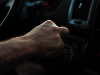 hand of a young man driving 