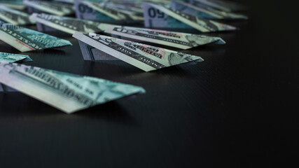 Paper planes made of dollar bills, usd cash flow concept. Global financial crisis,