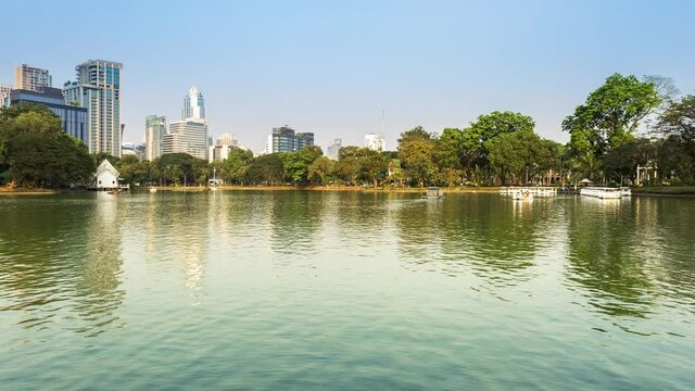 Footage 4k Timelapse of city view from Lumpini park in Bangkok, Public park where is settle at the center of Bangkok on a rented boat activity.