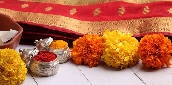 oti bharne - Indian ritual of offering a sari and a blouse piece along with coconut, haldi kumkum, bangles, mangalsutra and rice. At the time of navratri to goddes or married woman.