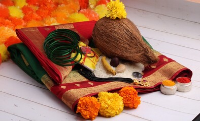 oti bharne - Indian ritual of offering a sari and a blouse piece along with coconut, haldi kumkum,...