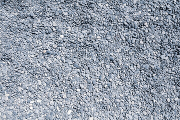 Stone pebbles on the sea as an abstract background.