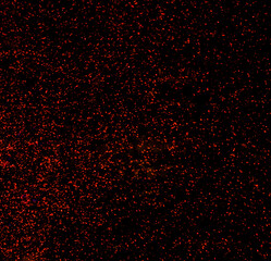 Fototapeta na wymiar Red sparks of fire on a black background.
