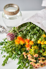 Series, step by step installation of flowers in a vase. Flowers bunch, set for home. Fresh cut flowers for decoration home. European floral shop. Delivery fresh cut flower.