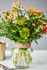 Series, step by step installation of flowers in a vase. Flowers bunch, set for home. Fresh cut flowers for decoration home. European floral shop. Delivery fresh cut flower.