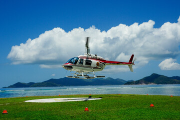 Fototapeta na wymiar Helicopter landing on a tropical island 