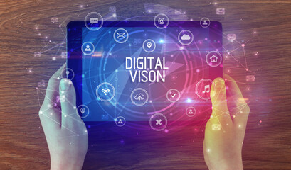 Close-up of a tablet with DIGITAL VISON inscription, innovative technology concept