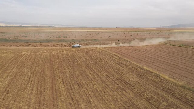 Aerial following of SUV racing car at international racing event