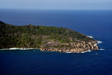 Fototapeta na wymiar Aerial view of a tropical island with coastline and blue ocean. Félicité Island, La Digue, Seychelles