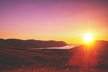 Beautiful rocky seascape in the evening. Rocks in the sea at sunset. Beautiful nature of Norway