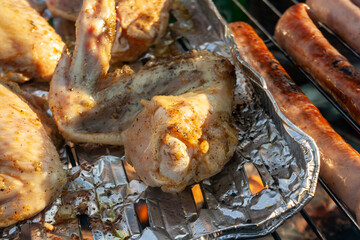 meat from chicken and pork  on barbecue grill cooked for summer family dinner concept