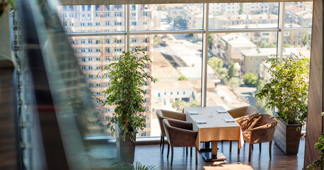 Luxury restaurant interior with city view