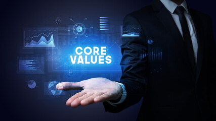 Hand of Businessman holding CORE VALUES inscription, business success concept