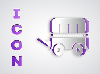 Paper cut Wild west covered wagon icon isolated on grey background. Paper art style. Vector.