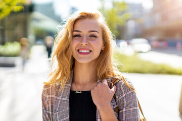 Portrait of attractive young woman outdoors
