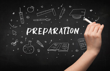 Hand drawing PREPARATION inscription with white chalk on blackboard, education concept