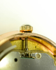 Macro closeup of retro rusty mechanism in the old clock. Gears and wheels inside.