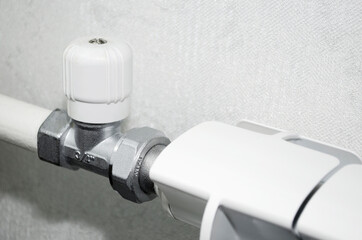 Close-up of the radiator valve. Heating system in an apartment or house