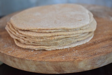 stack of rolled wheat flour flat bread base or poori base indian cuisine