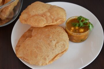 oil fried puffed poori with chana masala indian cuisine