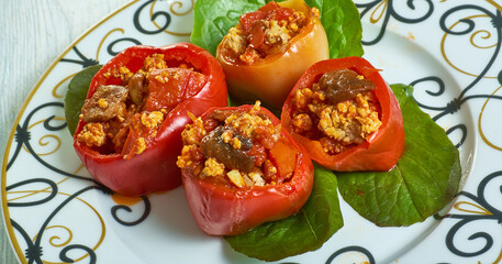 Mushroom, minced meat, tomato stuffed baked peppers