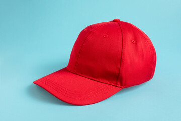 Red Baseball Cap on blue background