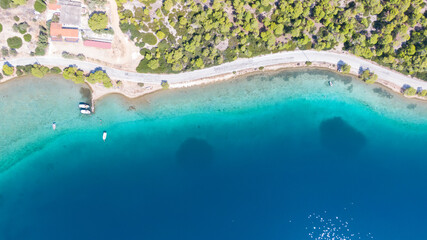 Aerial view on turqouise blue water and sandy beach of Limni Vouliagmeni or Ireon Lake, Peloponnese, Greece  