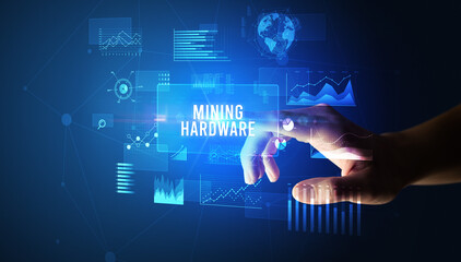 Hand touching MINING HARDWARE inscription, new business technology concept