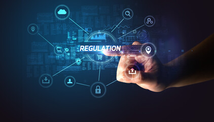 Hand touching REGULATION inscription, Cybersecurity concept