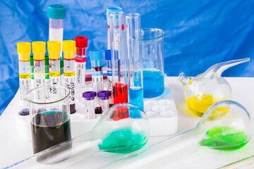 Laboratory, blood test tube samples and glassware with liquid chemical elements.