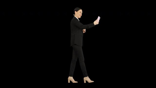 Young female in a suit having business video call on her phone, Alpha Channel