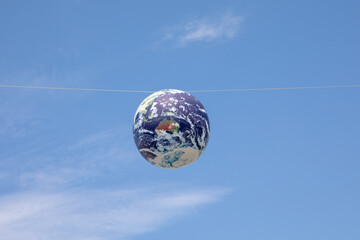 Earth Model floating in the sky.
