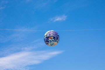 Earth Model floating in the sky.