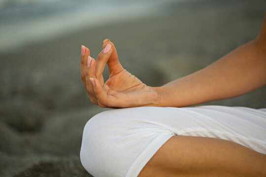 Yoga concept. Closeup image of lotus pose and mudra gesture